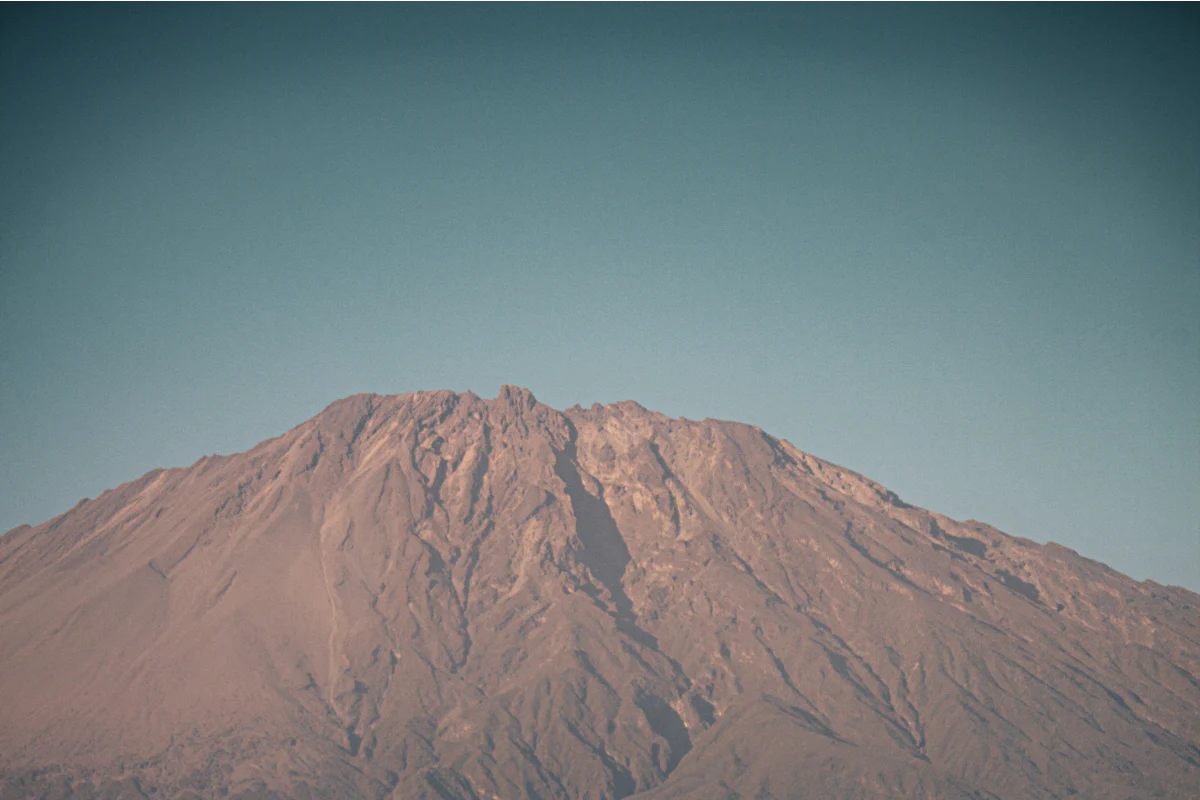 Mount Meru rising above the land near Arusha